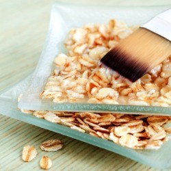 Two small glass square dishes filled with oatmeal mixture.