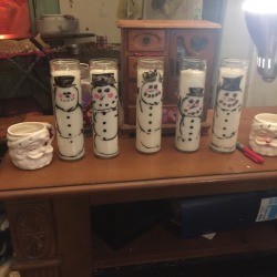 Waving Snowman Candles - several snowman candles on table top