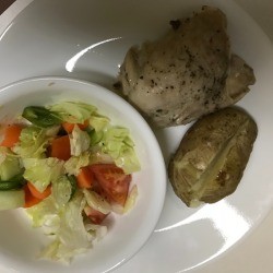 Pressure Cooker Chicken Thighs on plate with potato and salad