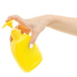 Woman Holding Pump Bottle