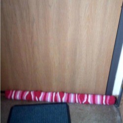 Christmas Draft Stopper - draft stopper at base of door