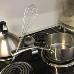 Built in Spoon Rest - wire whisk handle in the hanging hole on a pot handle