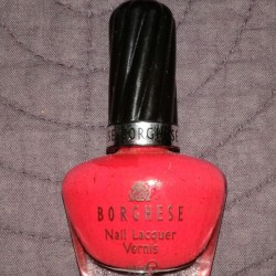 A bottle of bright nail polish.