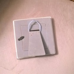 A frame with an easel back that has a loop to hang on the wall.
