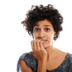 Woman biting her nails.