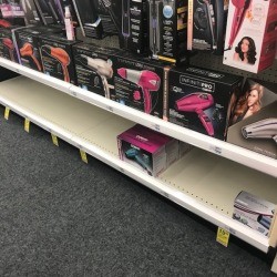An empty shelf for an item on sale.
