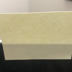 A webcam on a computer covered up by a Post-It note.
