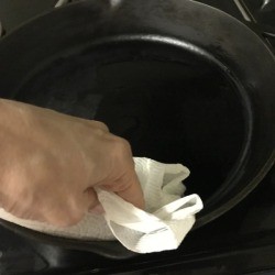 Seasoning a Cast Iron Pan with Crisco.