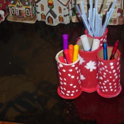 Using old decorated ribbon rolls as a pen holder