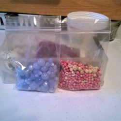 packages of different sized beads.