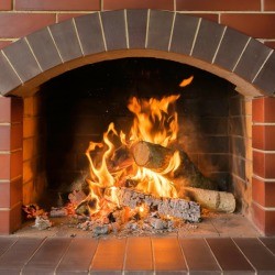 Brick Fireplace with Fire Burning