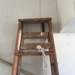 Safe Ladder Storage - ladder hanging on wall 
