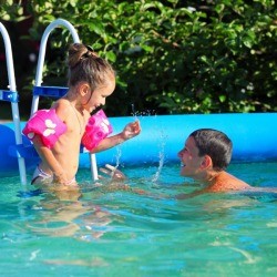 Kids Playing in Above Ground Swimming Pool