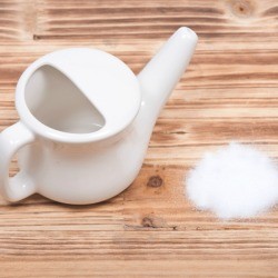 Neti Pot with a pile of salt.