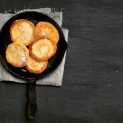 Fritters Cakes in a cast iron pan.