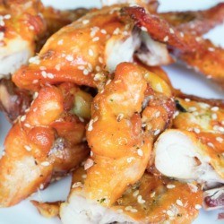 Baked chicken with sesame sauce and sesame seeds on rice.