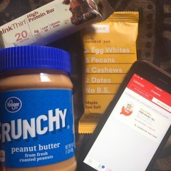 Free products from the supermarket next to a smartphone.