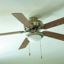 Ceiling fan with faux wood blades.