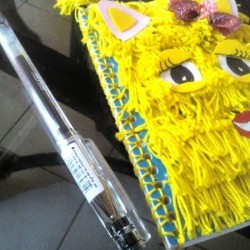 A finished notebook that is bound with yarn instead of a spiral spring.