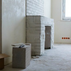 Large brick fireplace being updated