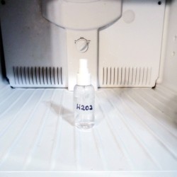 Clean Fridge And Freezer Interior With Peroxide - bottle inside the freezer