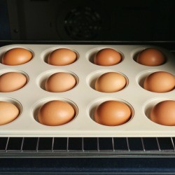 Eggs in a muffin tin in the oven.