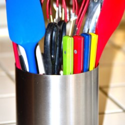 An organized kitchen utility crock. 