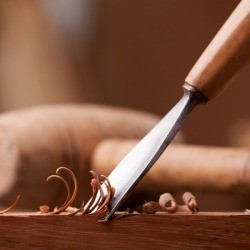 Closeup gouge for wood on carpenter workbench.