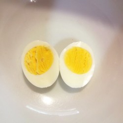A hard boiled egg cut in half.