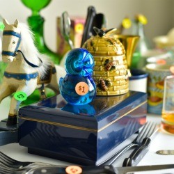 Trinkets on a table with price tags.