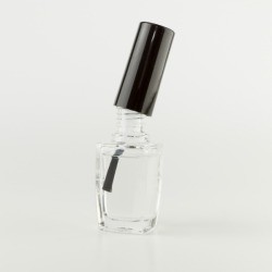 Clear nail polish on white background.