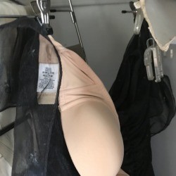 Parts of a complete outfit all stored together on a hanger.