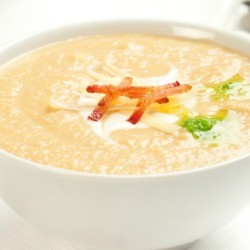 Creamy Celery Apple Soup in a white bowl.