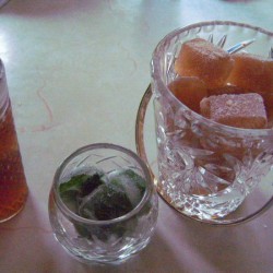 Cubes of frozen iced tea and spearmint.