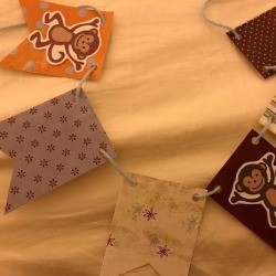 Monkey Theme Decoration Banner - finished banner with a monkey printout on two of the solid color flags
