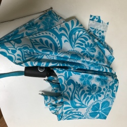 An old and broken Totes umbrella.