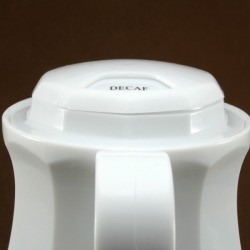 White plastic coffee carafe.