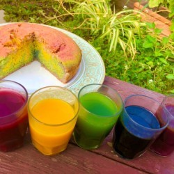 DIY Organic Food Colouring - containers of food colors next to a swirled cake 