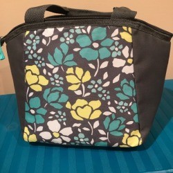A small drink cooler that can double as a padded lunchbox.