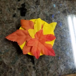 A tiny gift box made from lids from Stax potato chips.