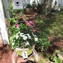 I Love Chairs As Planters In My Garden - round chair planted flowers in the garden