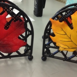 Artificial fall leaves placed on napkin dispensers.