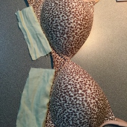 Bra with fabric patches attached to the underside of the bra cups.