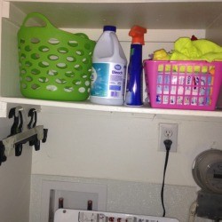 Dirty towels stored in smaller baskets in the laundry room.