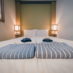 Japanese yukata and towel on bedroom in hotel, Tokyo, Japan. 