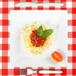 Big plate and small plate of spaghetti.
