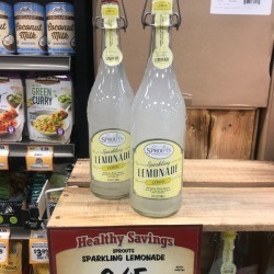 Two reusable glass bottles of sparkling lemonade.