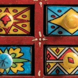 Brightly painted small drawers. 