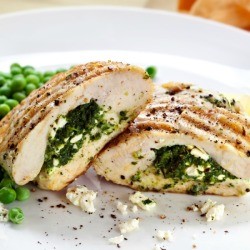Feta Stuffed Chicken Breasts with aside of peas.