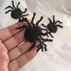 How to Make Hot Glue Spiders - spider sitting on maker's hand 